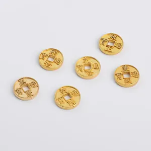 Detail of antique gold Five Emperor coins with embossed Qing Dynasty Chinese characters