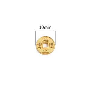 Macro shot of 10mm golden Chinese antique coin charm for DIY jewelry accessories