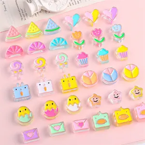 Close-up of colorful acrylic smile heart beads for DIY jewelry and phone chain accessories