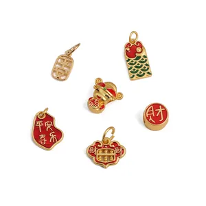 Set of 6 gold-plated charms including abacus and fortune koi with red enamel details
