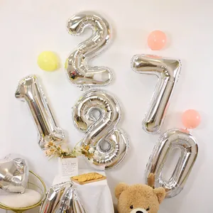 Detailed view of 32-inch silver number balloons for birthday party and wedding decoration