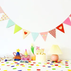 Birthday party decoration set with colorful banner, hats, glasses and cake topper
