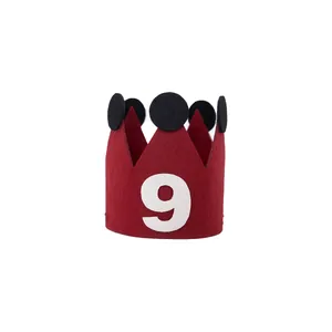 Red felt birthday crown hat with white number 9 and black dots for party celebrations