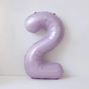 Detail of a 40-inch cream purple number 2 balloon for birthday party decorations