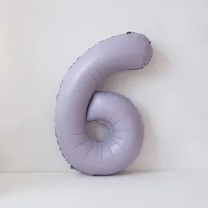 Detail of a matte lavender number 6 foil balloon for birthday party decorations