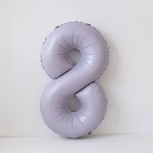 Detail view of a matte pastel purple number 8 foil balloon for birthday party decorations