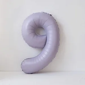 Detail shot of a matte lavender 40-inch number 9 foil balloon for birthday party decor