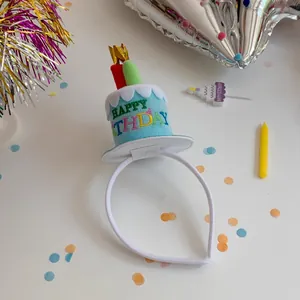 Macro detail of plush cake headband with Happy Birthday embroidery and mini candles