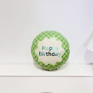 Detail of 18 inch green checkered foil balloon with Happy Birthday script for parties