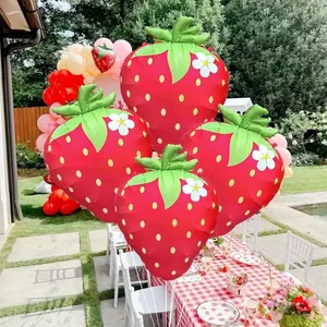Vibrant matte strawberry foil balloon decoration for kid's birthday party outdoors