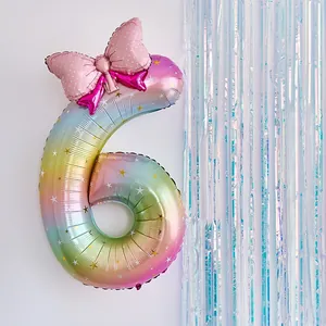 Rainbow gradient number 6 balloon with pink polka dot bow for girls birthday party