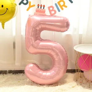 Close-up of 40-inch pearlescent pink number 5 foil balloon for birthday party decoration