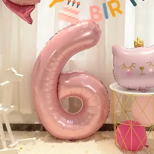 Detail of 40-inch pearlescent pink number 6 foil balloon for birthday party decorations