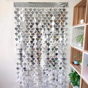 Silver heart-shaped tinsel fringe curtain for party backdrops and festive wall decoration
