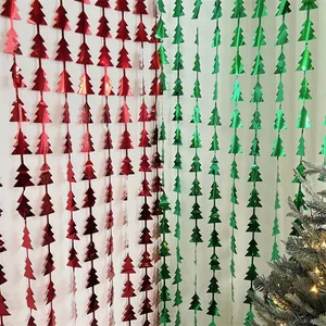 Close-up of red and green metallic Christmas tree tinsel curtains for wall decoration