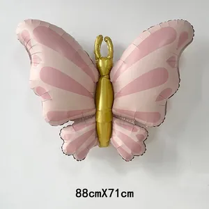 Detail view of pink and gold 3D butterfly foil balloon measuring 88cm by 71cm
