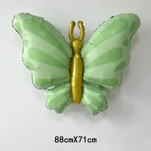 Macro view of green and gold butterfly foil balloon showing texture and 88cmX71cm size