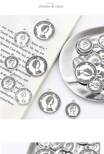 Macro detail of silver alloy coin pendants with Queen Elizabeth portrait for jewelry making
