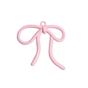 Pink alloy bow pendant accessory for DIY jewelry making with smooth painted finish