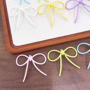 Colorful matte alloy bow pendants for DIY jewelry making in assorted candy colors