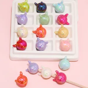 Detail of colorful iridescent acrylic bunny beads for handmade DIY jewelry and phone charms