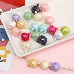 Macro shot of colorful acrylic rabbit beads with pearlescent finish for DIY jewelry