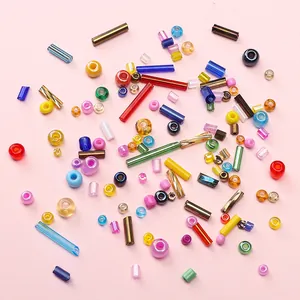 Close-up of colorful mixed glass beads in various shapes for DIY jewelry making kits