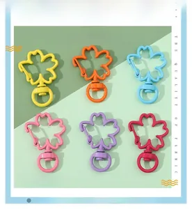Macro shot of colorful sakura cherry blossom alloy lobster clasps for DIY keychains