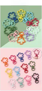 Macro shot of sakura flower shaped lobster clasps in colorful matte painted alloy finish