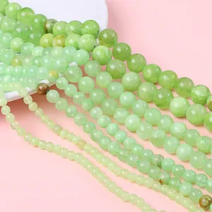 Macro view of assorted light green natural stone beads in various sizes for DIY jewelry