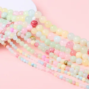 Macro shot of colorful macaron synthetic gemstone beads in various sizes for DIY jewelry