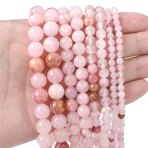 Detail shot of various sizes of smooth pink quartz beads for DIY jewelry making