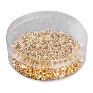 Golden bullet clutch earring backs stored in a clear round plastic storage container