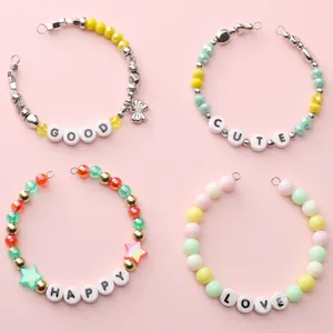 Set of four pastel ceramic beaded bracelets with GOOD CUTE HAPPY LOVE alphabet charms