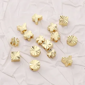 Goldene Schmetterlings- und Blumenperlen mit radialer Textur für DIY-Schmuck