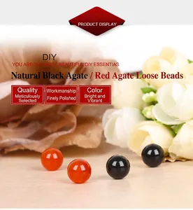 Macro detail of polished natural red and black agate loose beads for DIY jewelry making