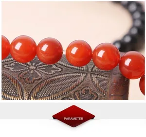 Macro detail of polished 7A black and red agate beads for DIY jewelry making
