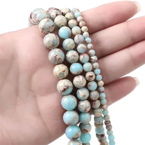Detail of sky blue round stone beads in 4mm to 10mm sizes for DIY jewelry making