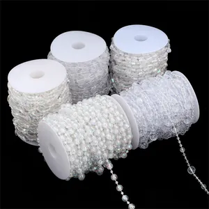 Detailed view of 5 rolls of iridescent white acrylic bead chains for wedding decor