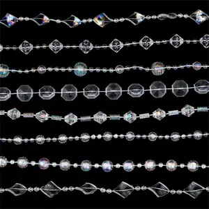 Detail of assorted clear and AB color crystal beads for wedding decor on dark background