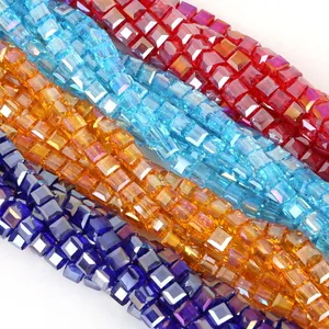 Detail of 8mm faceted square glass crystal beads in red, blue, gold and purple for DIY jewelry