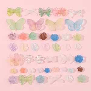 Set de dijes DIY de flores y lazos en acrílico mate con colores degradados macaron