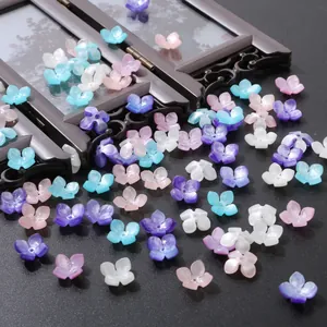 Macro detail of 14mm shell-like flower charms for DIY hairpins and jewelry making