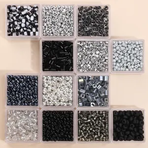 DIY jewelry kit with dark colored glass seed beads and tubes in acrylic boxes