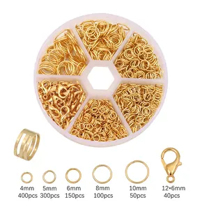 Golden jewelry making kit with various open jump rings and lobster clasps in a clear box