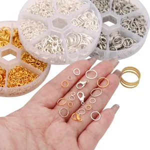 Detail of jewelry DIY kit with metal lobster clasps and jump rings in a storage box