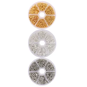 Macro shot of 6-grid boxes with gold and silver lobster clasps and jump rings for DIY jewelry