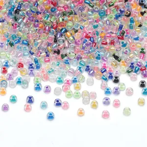 Colorful mix of 2-4mm glass seed beads for DIY jewelry making on white background