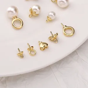 Detail of 14K gold plated earring connectors and pearl caps for DIY jewelry making