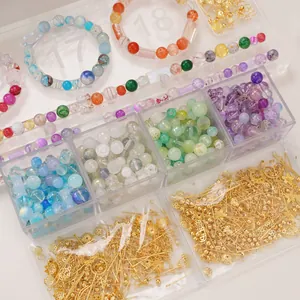 Detailed view of DIY jewelry kit with mixed glass beads, alloy charms and storage box